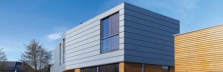 Maison individuelle avec façade en profilé horizontal Maison individuelle avec façade en profilé horizontal